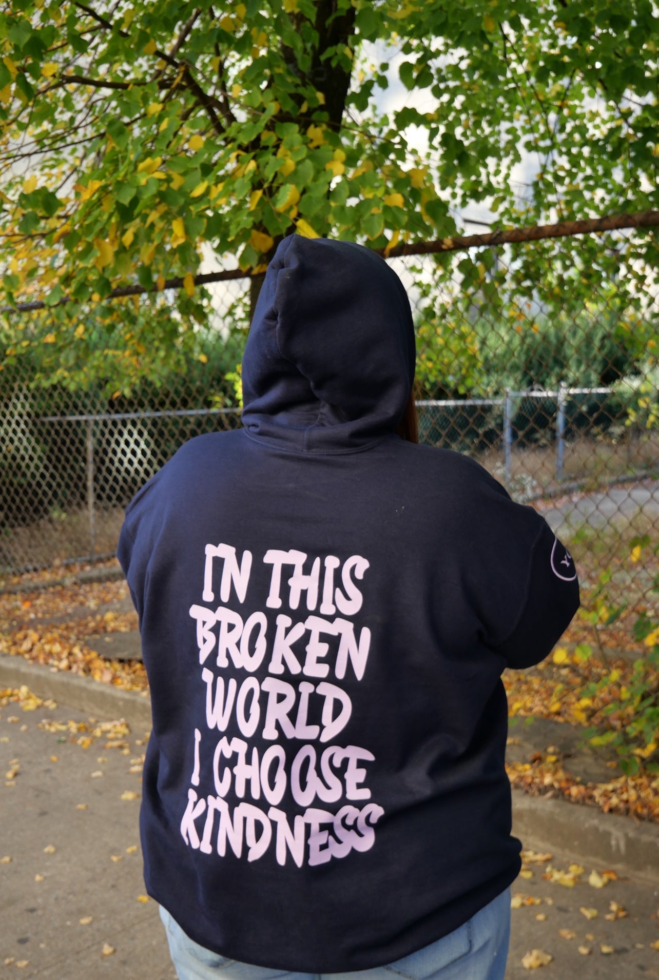 In this broken world I choose kindness navy affirmation hoodie be kind Back view woman wearing hoodie