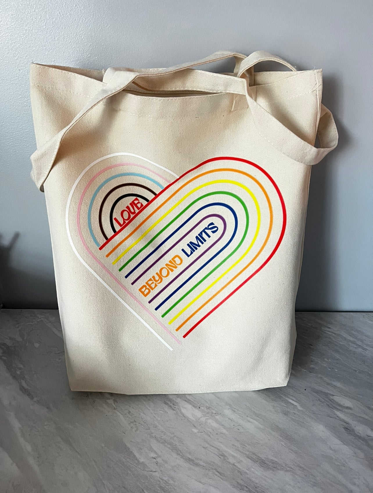 LOVE BEYOND LIMITS TOTE BAG